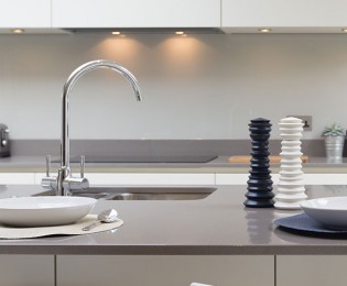 Sink with contemporary high-arc faucet in kitchen island at 2Hopkins apartments