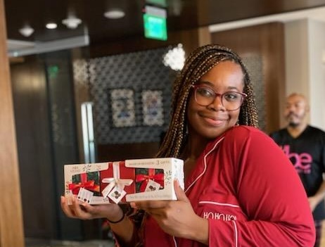 2Hopkins resident holding a gift